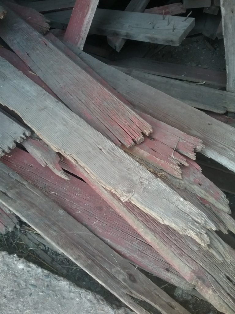 pile of barnwood from the crib that was torn down
