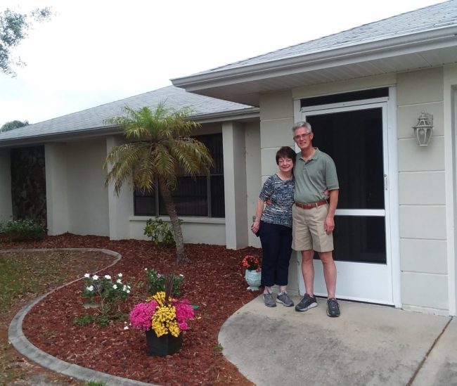 David & Kimberly Snyder in front of their home