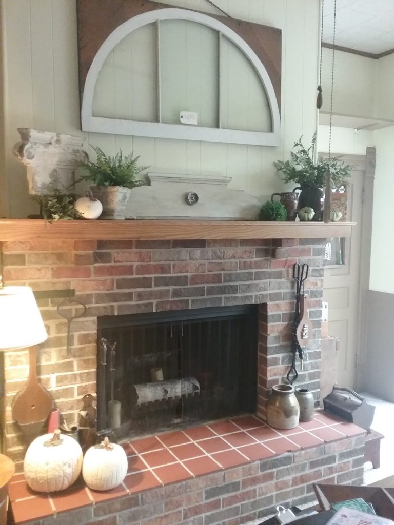Farmhouse Mantel accented with architectural salvage