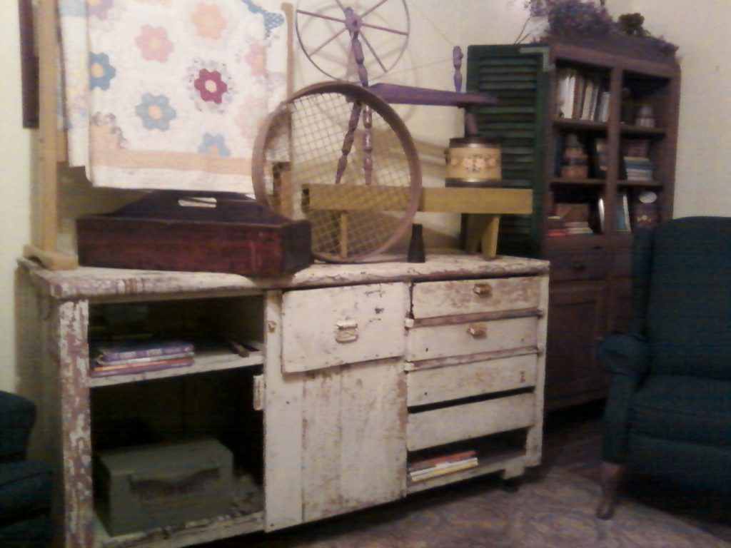 Primitive accents displayed on cabinet
