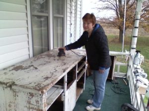 Primitive Cabinet - using hand sander