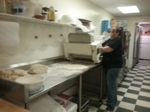Tara rolling out the dough