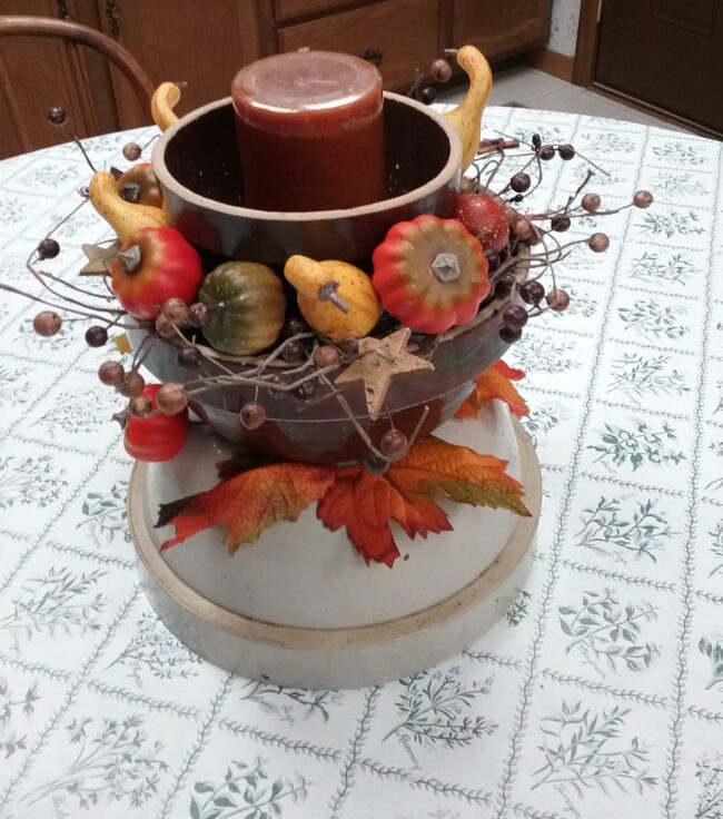 a trio of crockery bowls decorated for Fall