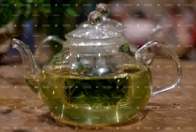 glass teapot with an herbal infusion