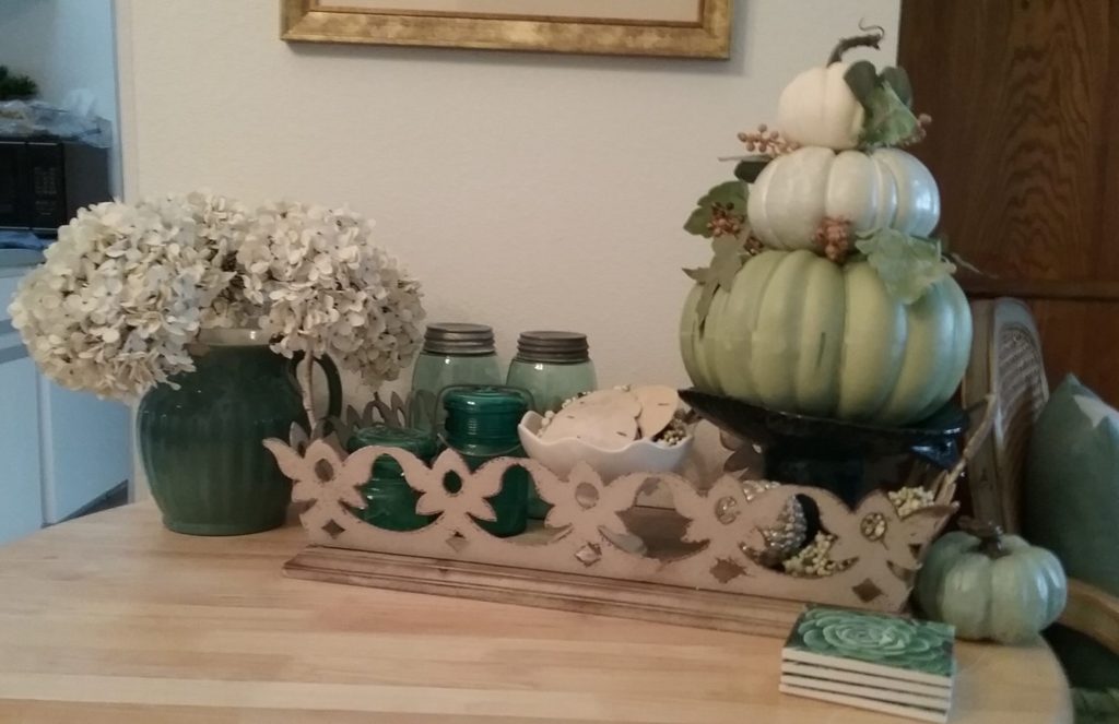 stacked pumpkins add autumn accents to the side table