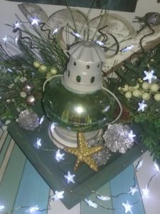 Lantern in a Christmas Display accented by an architectural salvage piece