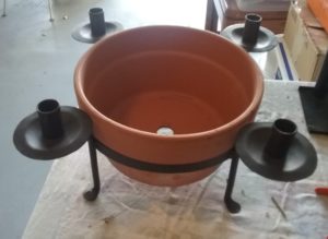 Terra cotta planter with iron candle holder