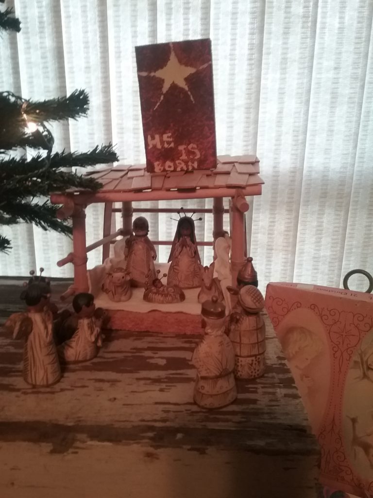 Nativity scene with He Is Born