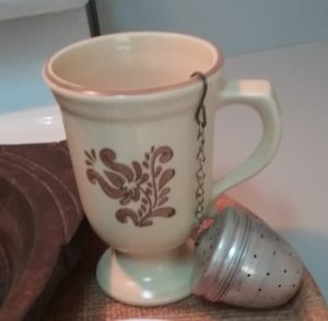 Village Tea mug with orange pekoe tea