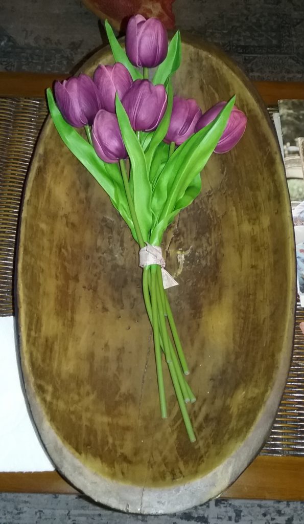 Pink tulips in dough bowl
