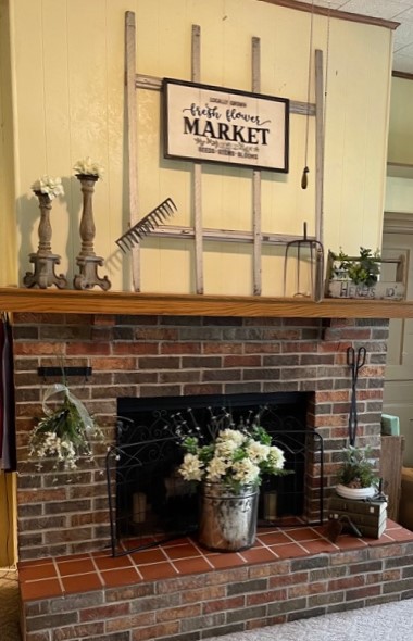 Farmhouse Fireplace staged for Late Spring with garden gates