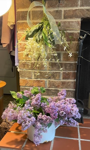 Lilacs on fireplace hearth