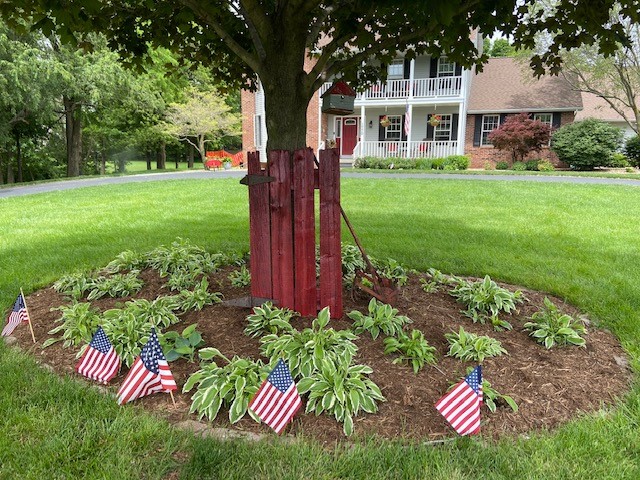 Patriotic yard decor with barn wood accent