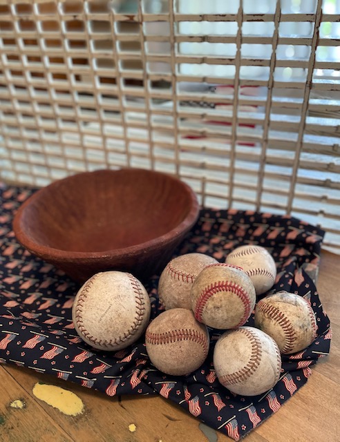 pile of vintage baseballs