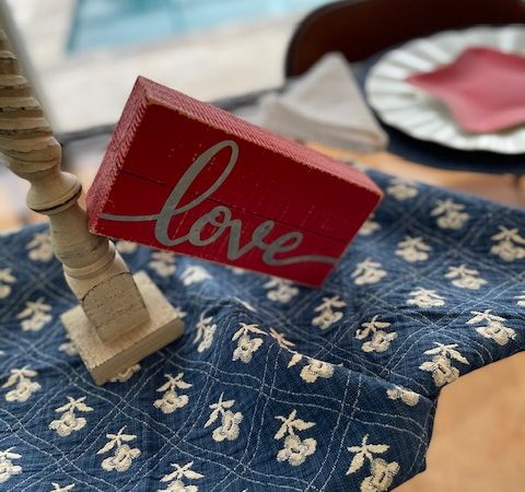 small red barnwood sign