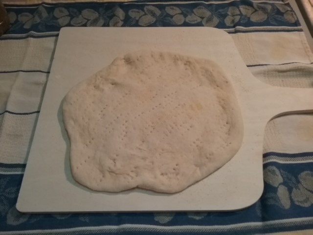 pizza dough rolled out & scored