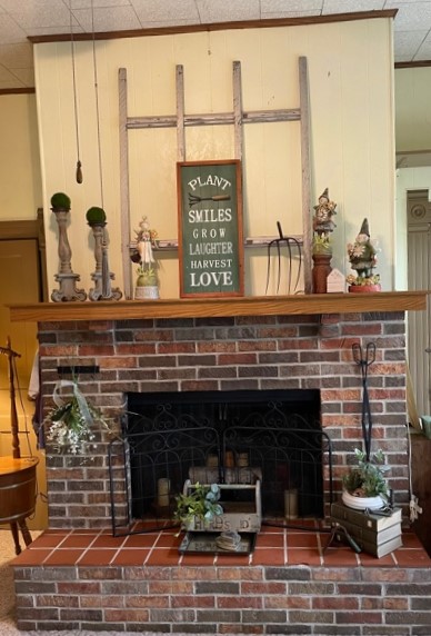 A garden themed display for the farmhouse fireplace mantel