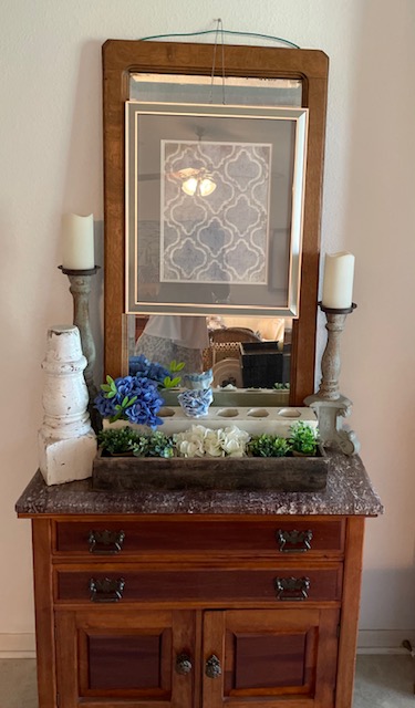 Marble topped chest with an oak framed mirror and vintage accents