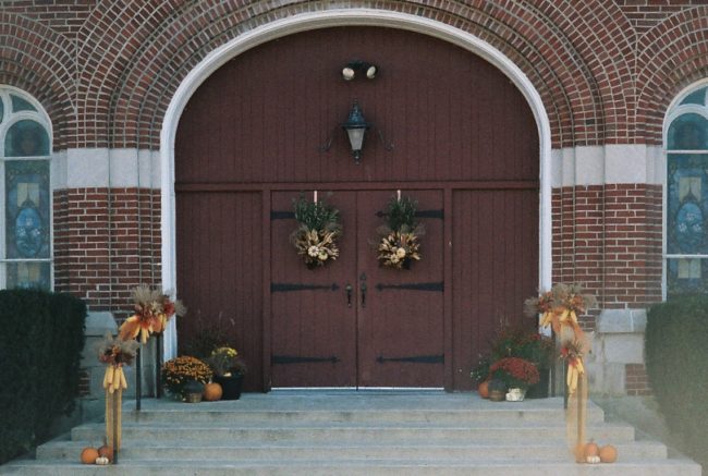 Small town Catholic Church Doors decorated for fall