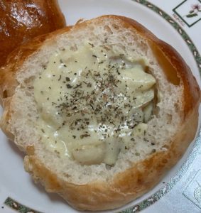 Bread bowl filled with Cheddar Potato Soup