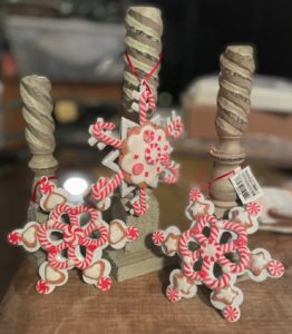 Snowflake ornaments hanging on spindles