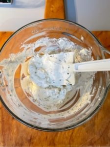 mixing bowl of blended herbed cheese