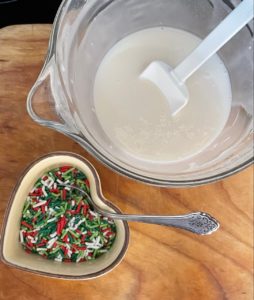Christmas nonpareils with a bowl of icing