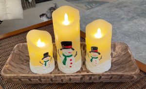 three adorable battery candles with snowman motif