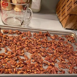 baking sheet of spiced pecans