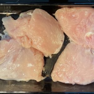 bonelless chicken breasts in baking dish