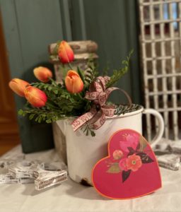 Valentine display with orange tulips