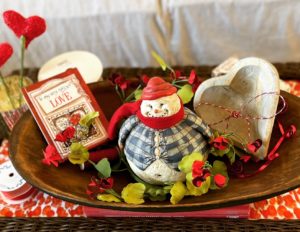 Pudge the snowman in a Valentine themed dough bowl
