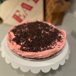 Chocolate sprinkles decorate the top of a Cherry Cheesecake