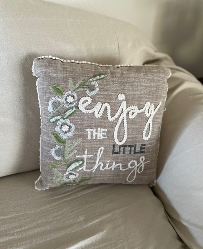 Pillow with embroidered saying