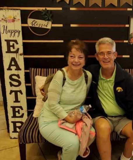 Kim & Dave in front of Easter sign
