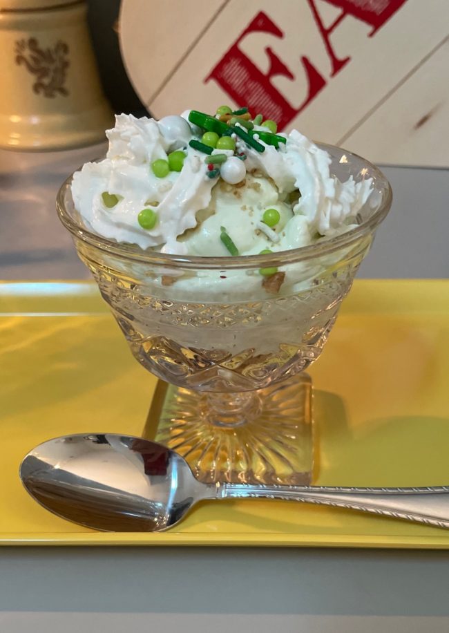 key lime cheesecake parfait in a footed dish