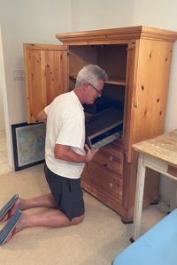 Dave unloading the armoire