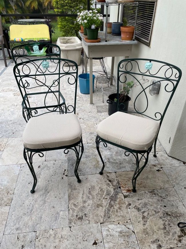 green wrought iron chairs refreshed with new paint and cushion covers