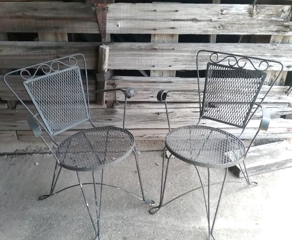 set of two wrought iron patio chairs