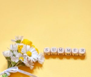 Summer spelled out in scrabble tiles
