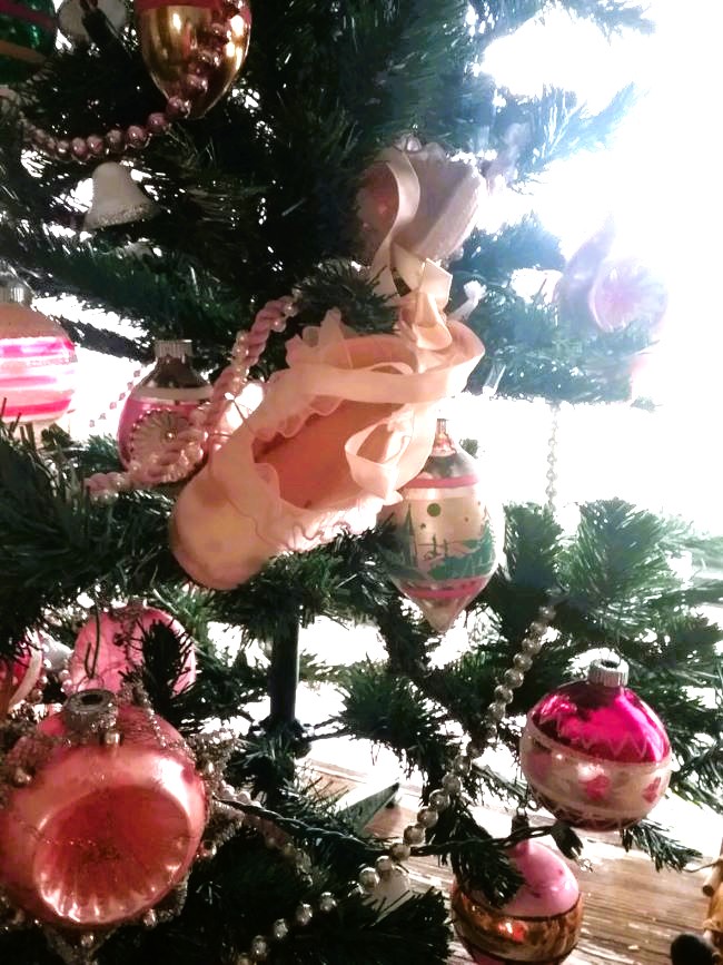 vintage ornaments on tree with baby shoe
