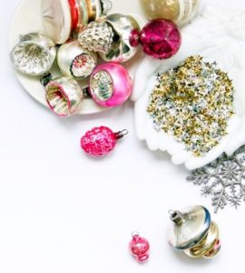 flat lay of pink holiday ornaments