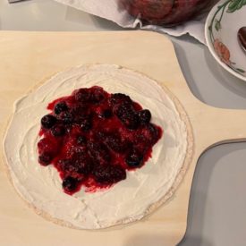 whole wheat tortilla with cheesecake filling and berries