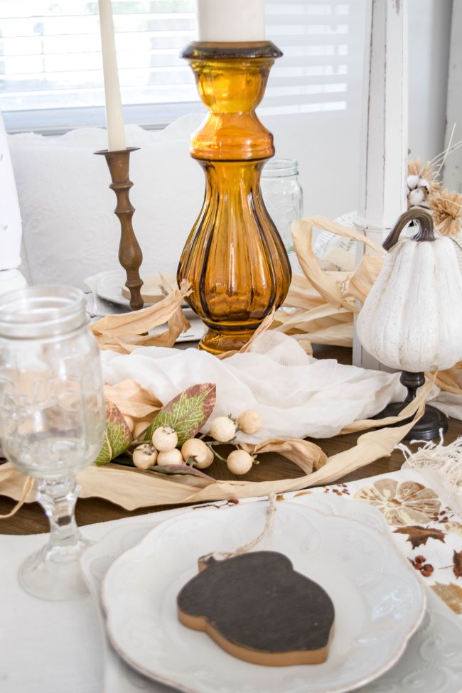 white place settings with amber accents