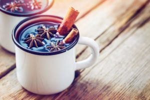 cinnamon sticks in a mug of mulled wine