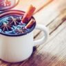 cinnamon sticks in a mug of mulled wine