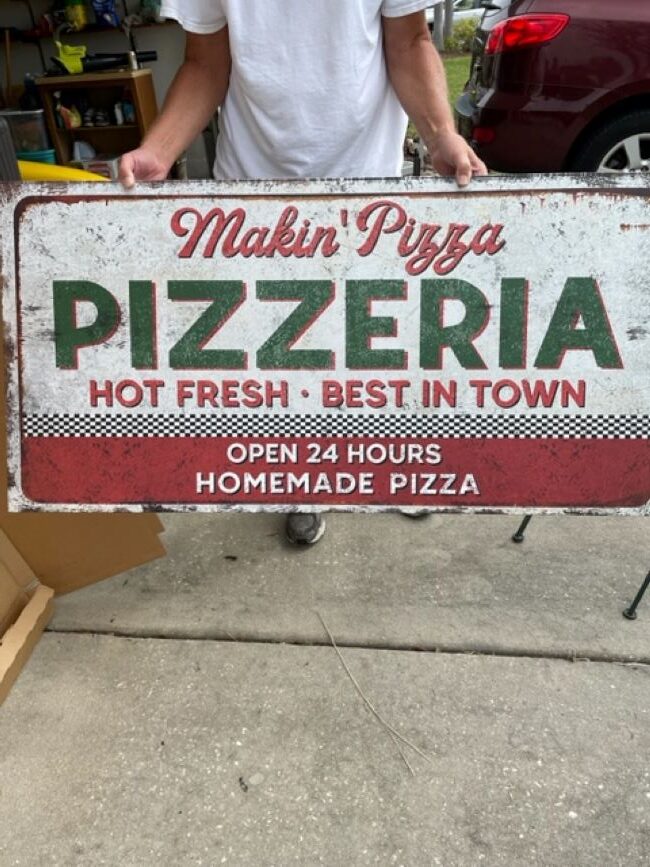 large canvas Pizzeria sign