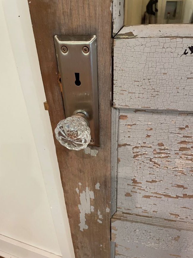 glass doorknob on an old panel door