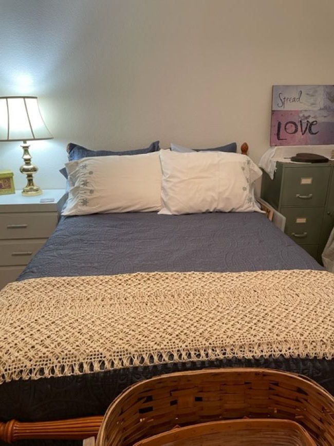 Blue bedspread & shams with crocheted blanket