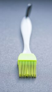 silicone basting brush with lime green bristles